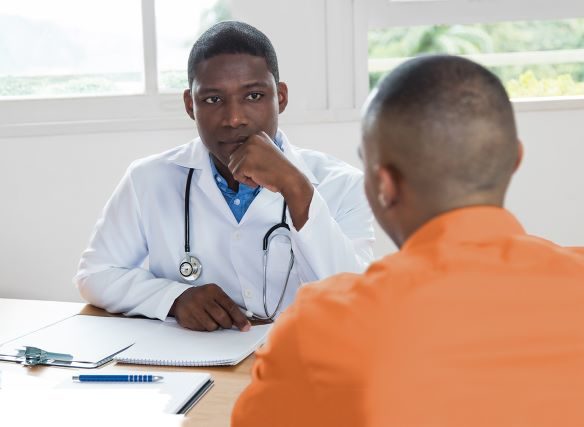 black doctor w inmate GettyImages 954160106 5 14